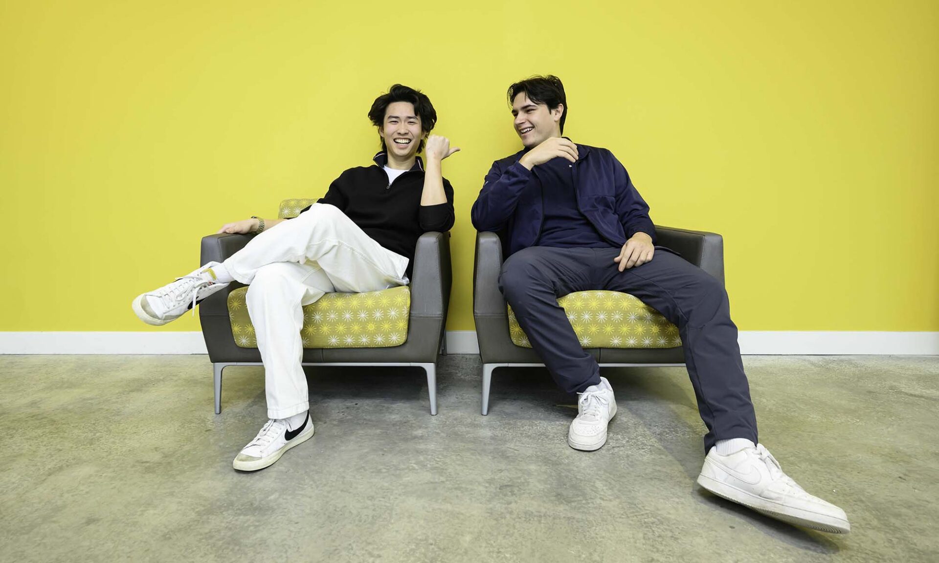 Walter McDonald and Stephen Lim sit on a bench